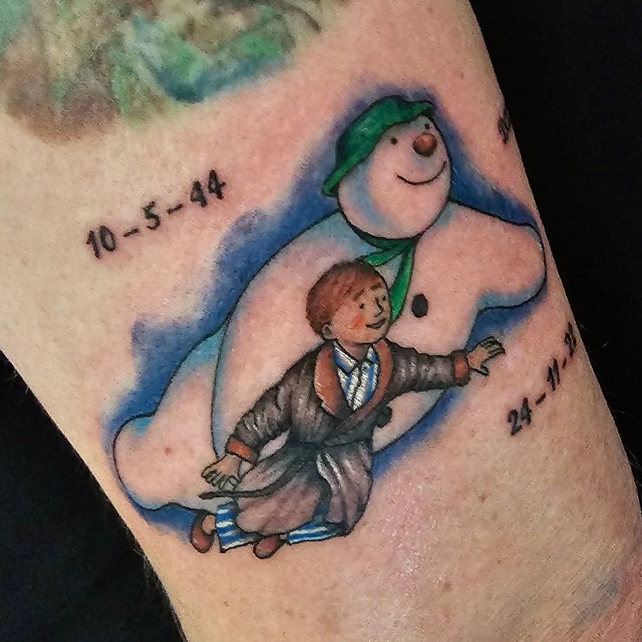 A man and Snowman Date Lower Leg Color Tattoo