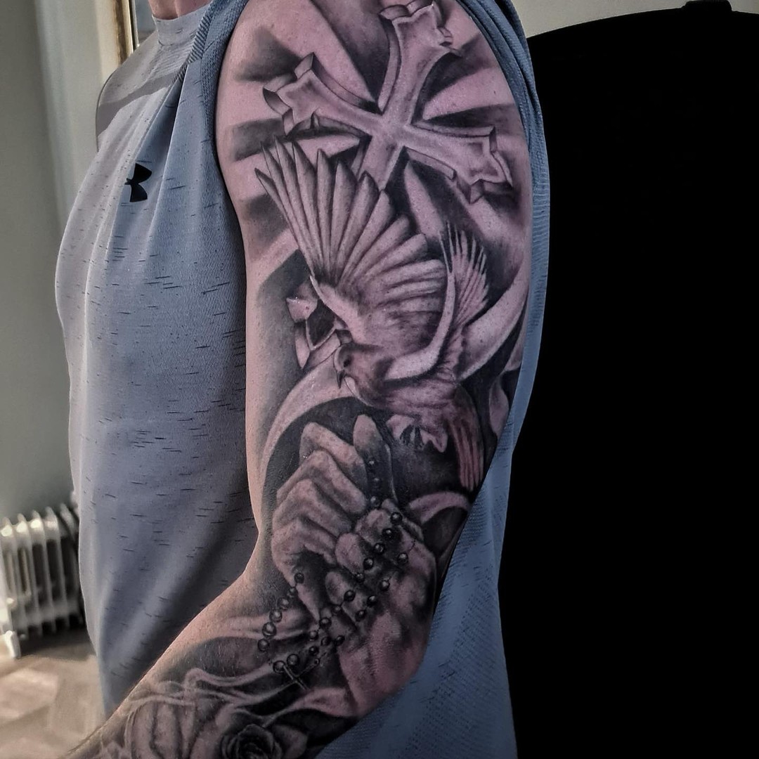 Transforming Arms into Art: Top 68 Tattoo Sleeve Ideas 13 Dove Cross and Rosary Sleeve Black and White Tattoo