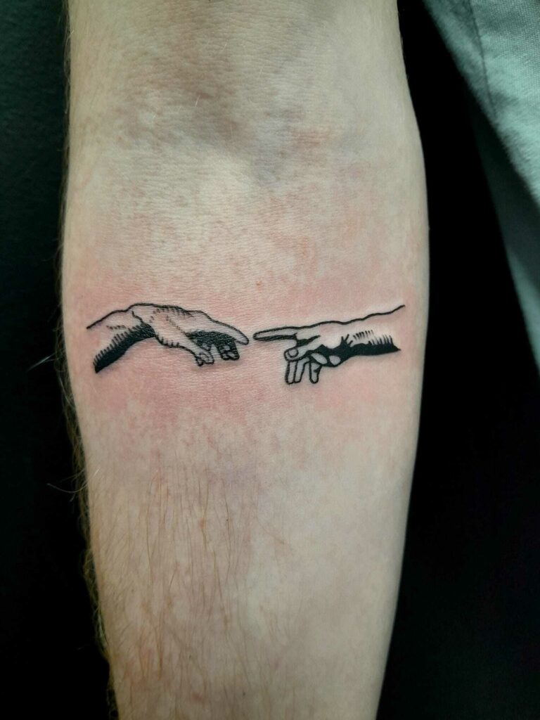 Finger Forearm Black and White Tattoo