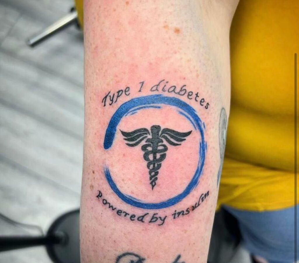 Logo Forearm Color Tattoo