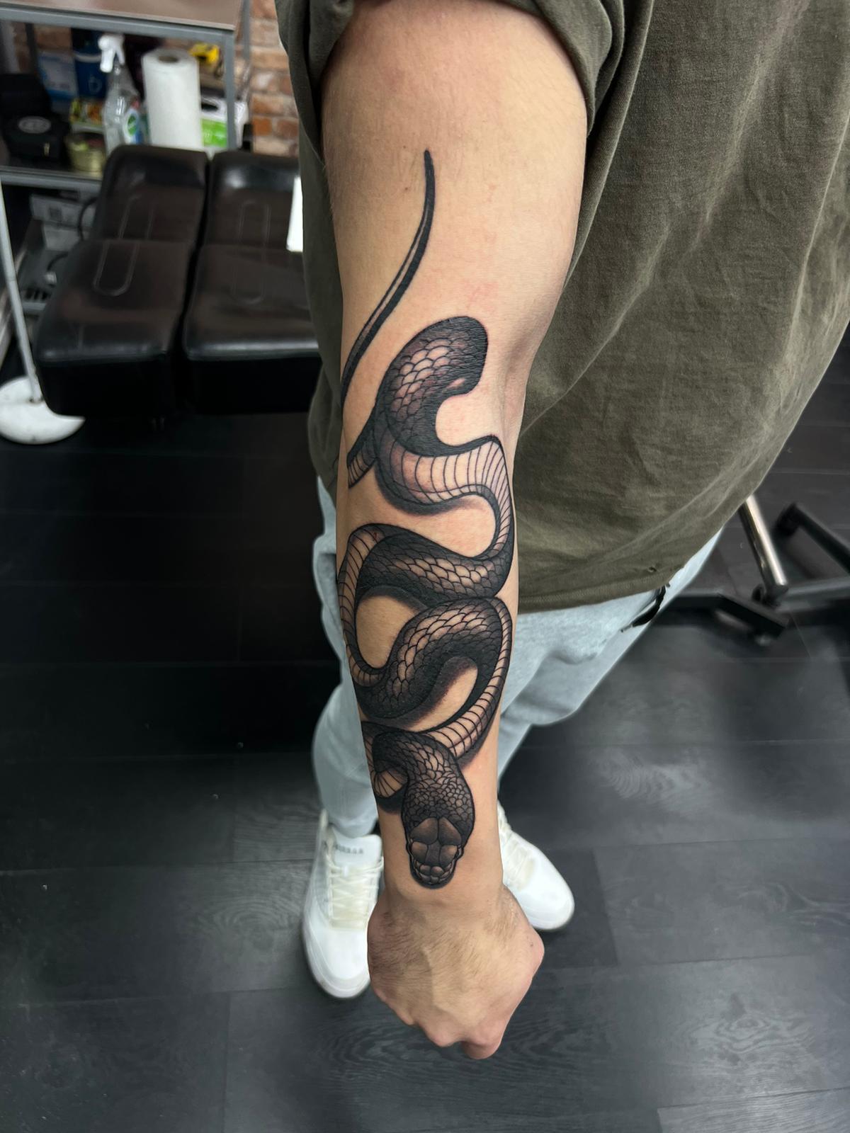Transforming Arms into Art: Top 68 Tattoo Sleeve Ideas 3 Snake Hand Black and White Tattoo 1