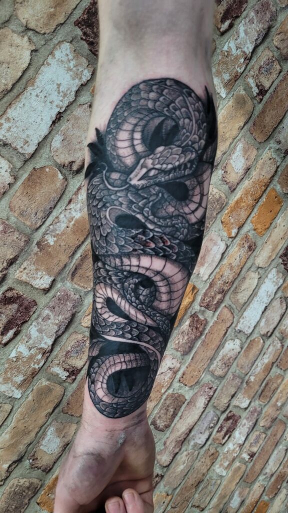 Black and White Snake Arm Tattoo