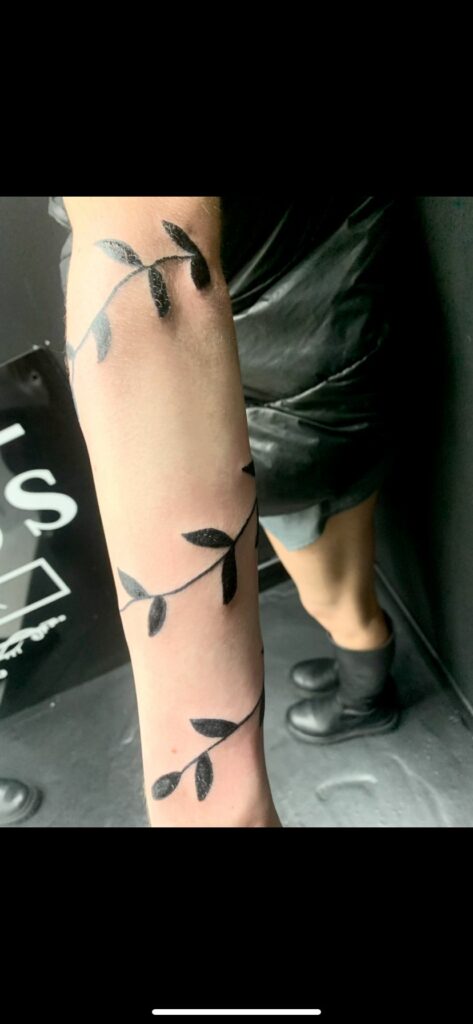 Flower Hand Black And White Tattoo