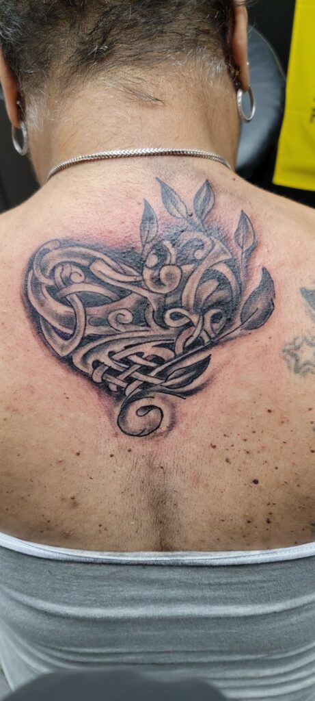 Heart Shaped Back Black And White Tattoo