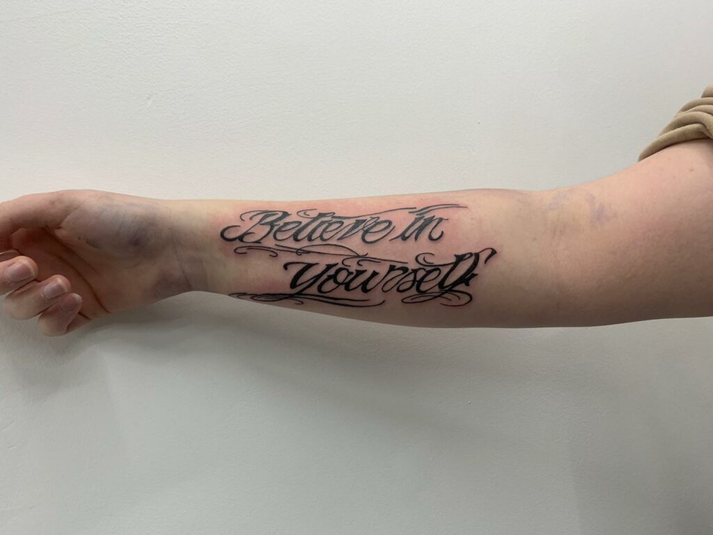Man Name Forearm Black And White Tattoo